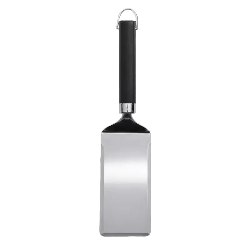 Metal spatula with black handle on a white background
