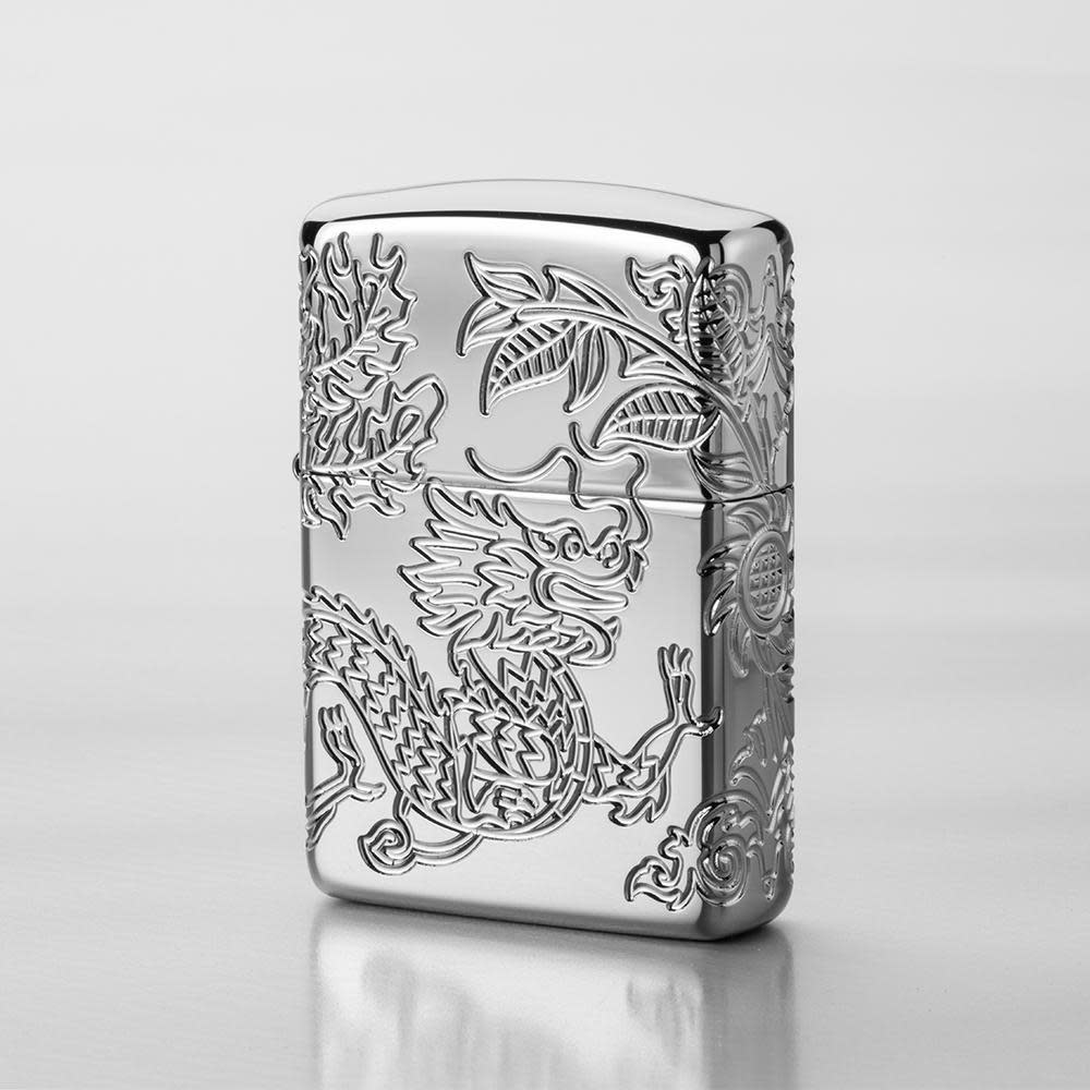 Lifestyle image of Armor?« Dragon and Phoenix Design Windproof Lighter with a grey background